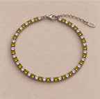 Bracelet Montou en argent 925, alternance de cristaux et de nano saphirs jaunes, avec fermoir et chaînette de réglage.