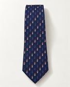 Cravate Miromesnil en jacquard de soie présentée à plat, petits rectangles colorés sur un damier bleu marine ton sur ton.