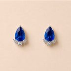 Paire de boucles bleues en goutte serties de pierres claires