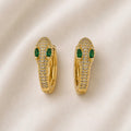 Paire de boucles dorées allongées avec détails verts