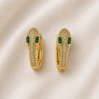 Paire de boucles dorées allongées avec détails verts